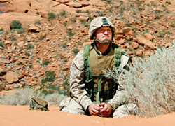 Soldier in keeping watch in desert